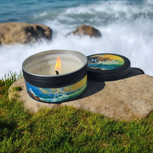 candle beside splashing coastline